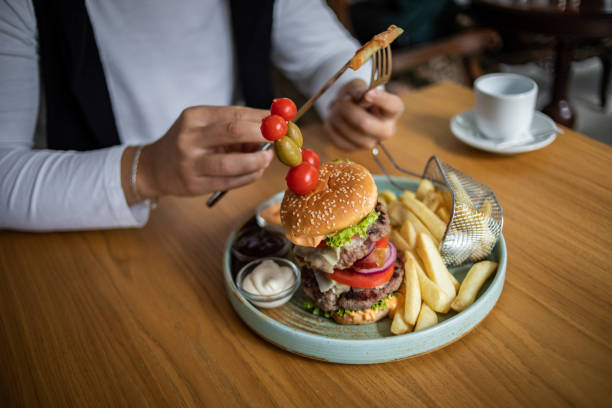 istock I enjoy the taste of this big hamburger 1430800275