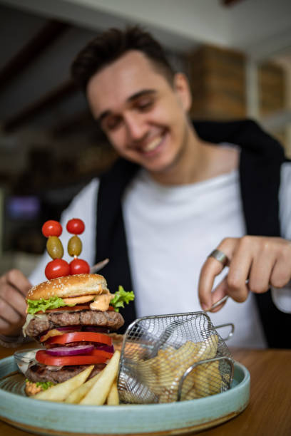 istock I enjoy the taste of this big hamburger 1430800293
