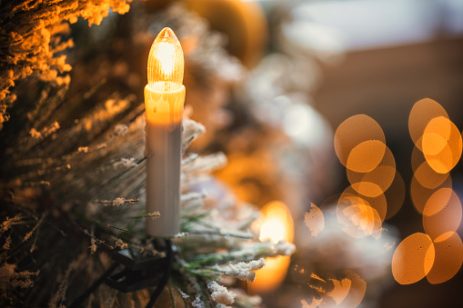 Beautiful candle light on Christmas tree