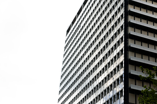 Modern apartment building, white background with copy space, full frame horizontal composition