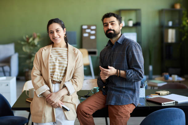 istock Two young successful designers or white collar workers in smart casualwear 1430804843