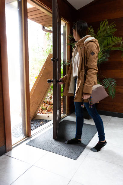 Receiving large package at front door from online order sequential