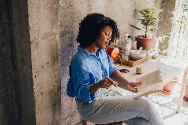 istock A Beautiful Woman Studying While Sitting Outdoors 1430813422