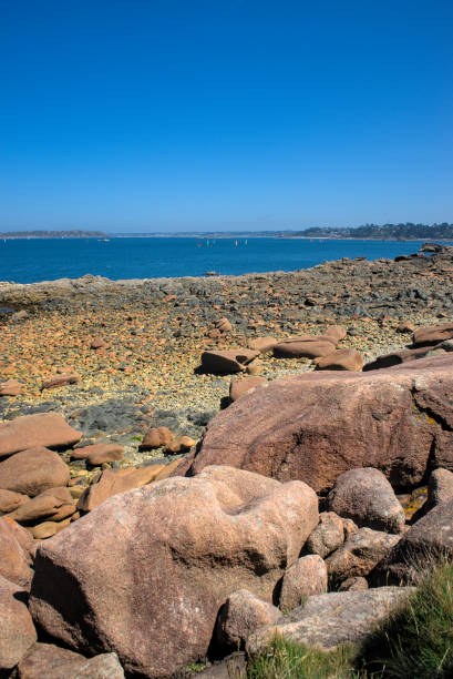 Monolithic blocks of pink granite in the Cotes d'Armor in Brittany, France. Pink granite coast