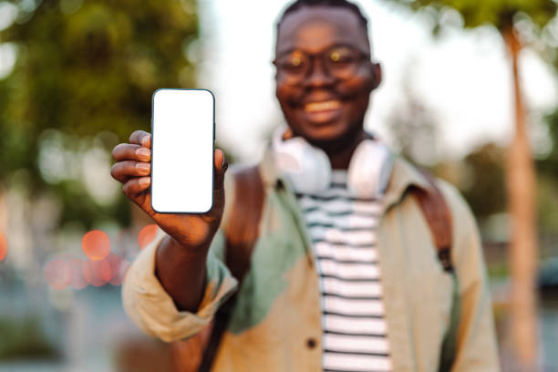 istock Portrait of a confident young man  showing mobile empty screen device 1430816431