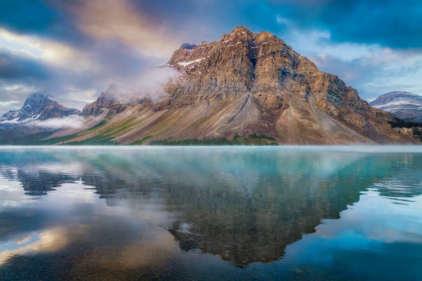 istock Cloudy Sunrise Bow Lake Mountain Reflections 1430816753