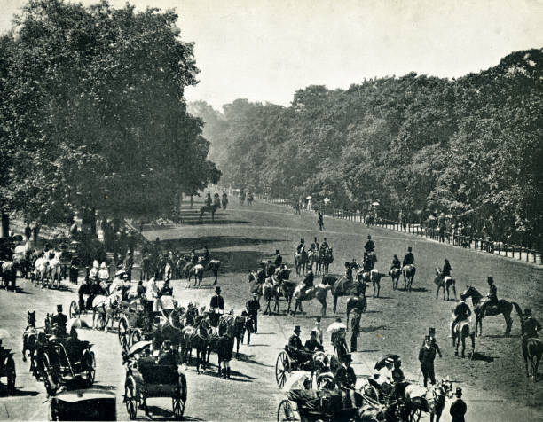 Hyde Park full of public walking or riding horses London 19th century Busy Hyde Park for people to ride, walk. Promenading during the reign of Queen Victoria and Prince Albert derby city stock pictures, royalty-free photos & images