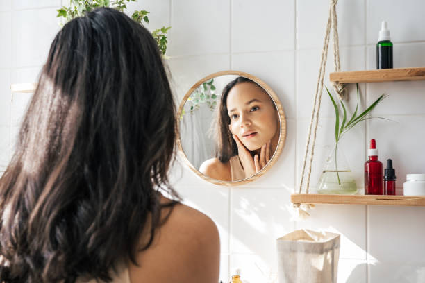 istock Beautiful woman looking in the mirror 1430820241