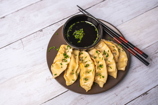 istock Homemade fried Asian potsticker dumpling appetizer. 1430822611