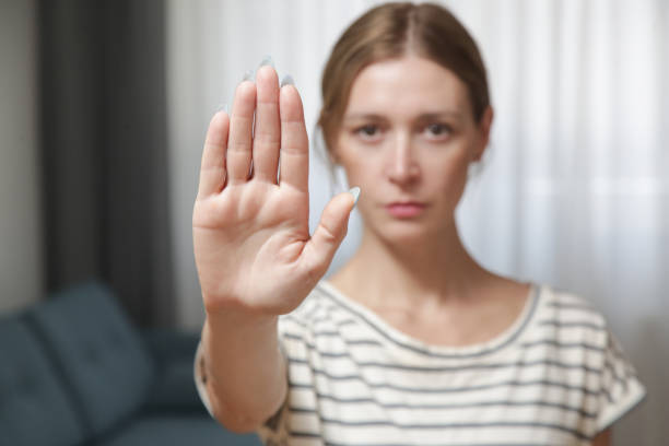 istock Serious worried young woman making hand stop gesture expressing fighting for equal rights against domestic violence, abuse, discrimination, bullying, sexual or racial discrimination. 1430822776