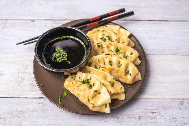 istock Homemade fried Asian potsticker dumpling appetizer. 1430822827