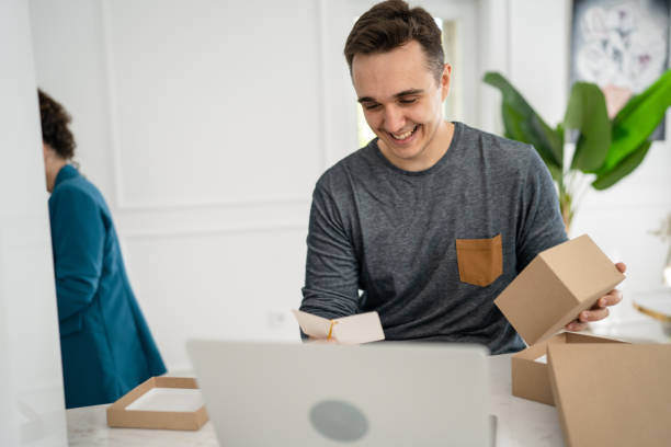 istock man open presents gift box in the kitchen read card 1430832681