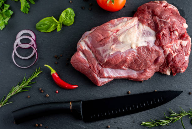 istock raw meat with spices on a dark background 1430840998