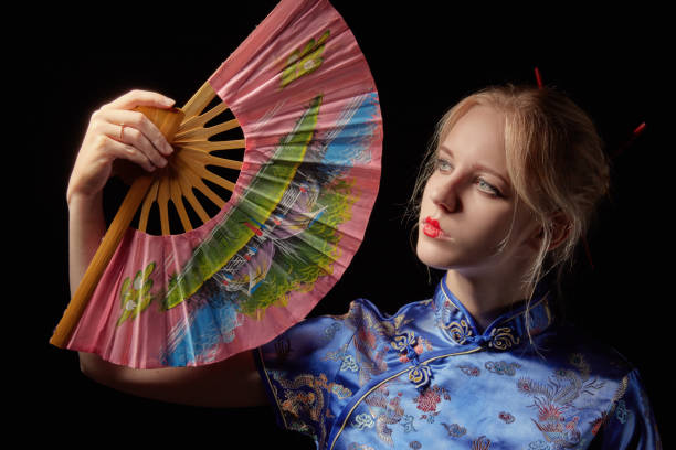 Chinese Han costume beauty taking an umbrella by the lake
