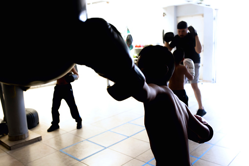 Against the light of a child boxing