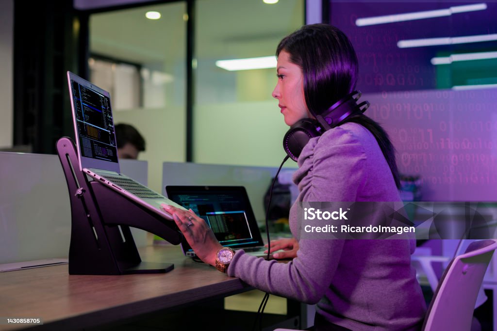 Female Programming Engineer Is Working Developing Codes For A New ...