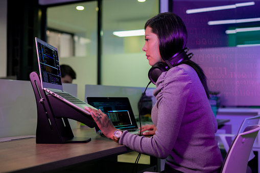 Female Programming Engineer Is Working Developing Codes For A New ...