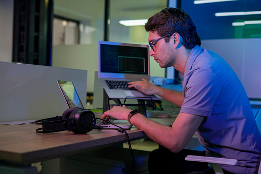 Young Programming Engineer Is Working Developing Codes For A New ...