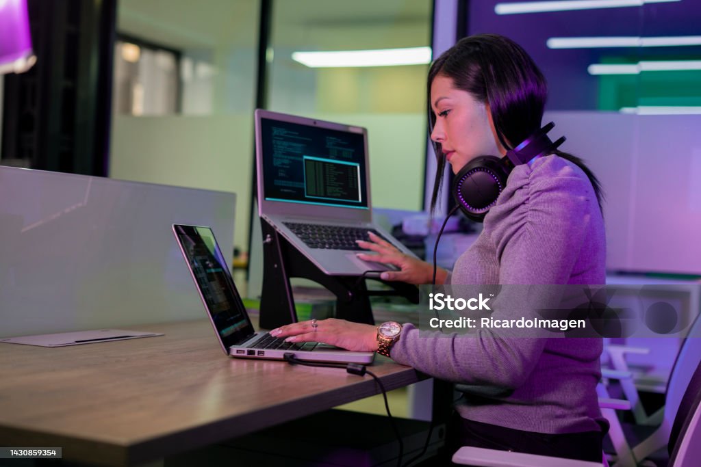 Female Programming Engineer Is Working Developing Codes For A New ...
