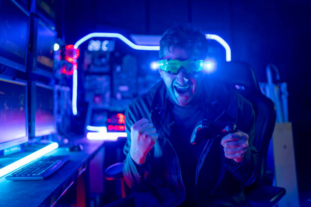 istock Caucasian and smart man hold game joy controller and look at camera also show action of excited look like success to with the game. 1430862486
