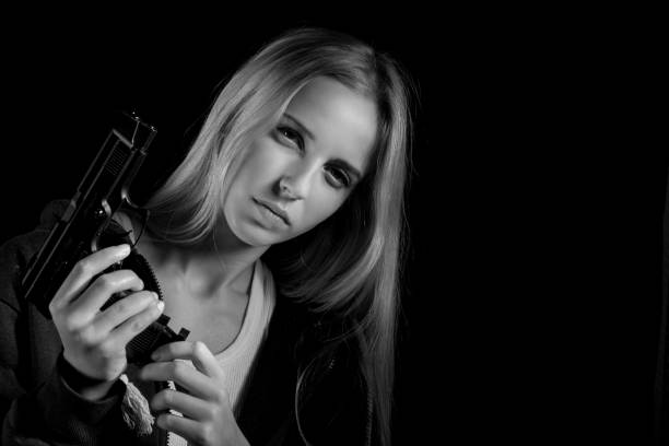 istock girl with gun 1430871856