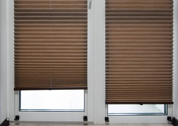 istock Pleated blinds close up on the window in the interior 1430874239