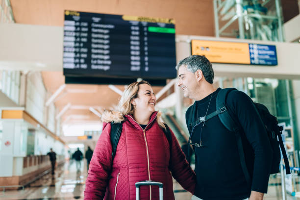 istock Happy couple at airport 1430882793