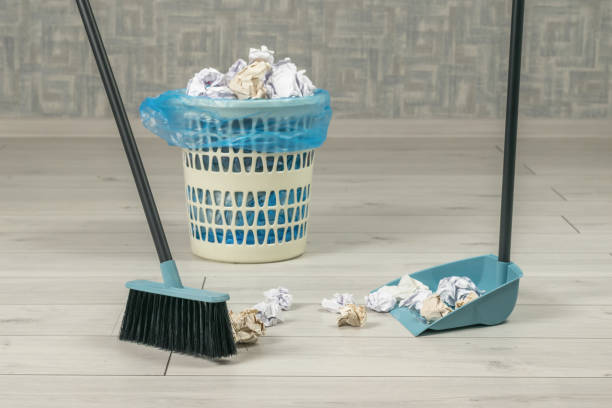 istock Cleaning paper garbage in the room with a hand tool. 1430883846