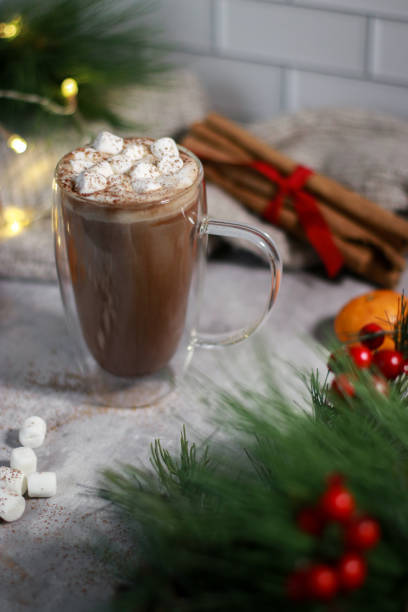 istock hot chocolate in a glass mug with mini marshmallows on grey table, blurred xmas background 1430886106