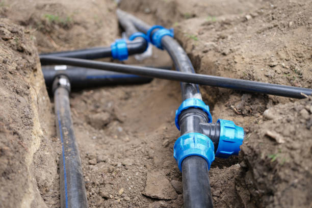 istock Black plastic pipes for irrigation in country 1430886221