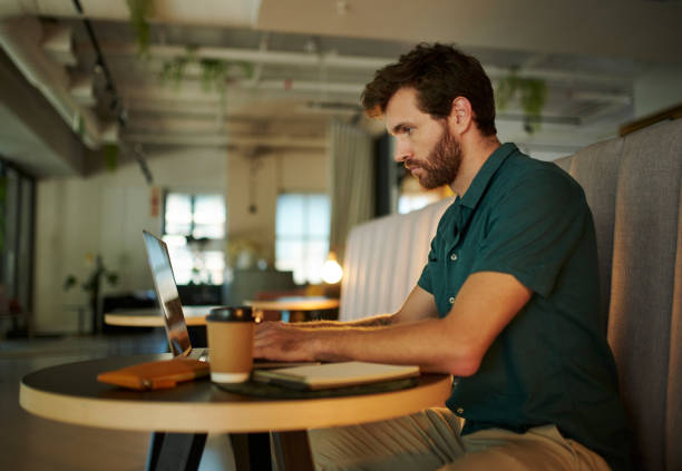 istock Working, reading and laptop in a coffee shop with a digital worker writing an email on a pc. Job, career focus of a man startup entrepreneur or digital web writer online in a cafe or restaurant 1430886855