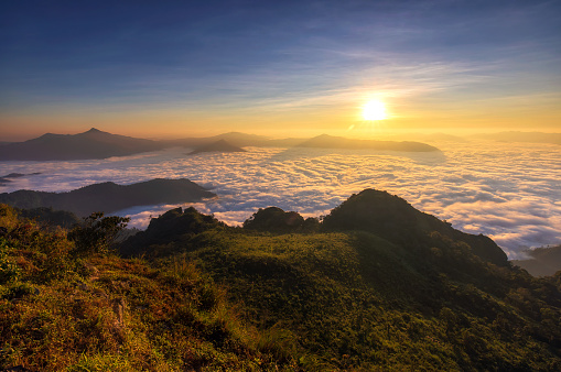 Beautiful nature landscape, sea of fog morning on hight mountains at sunrise, Chiang Rai province of Thailand.