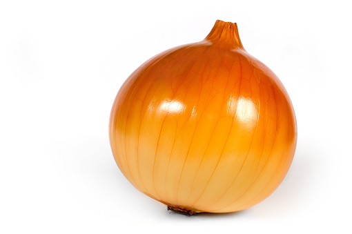 A large bulb of onions on a white background. Fresh bulb of golden color.