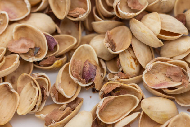 istock Pile of pistachio shells isolated on white background 1430893283