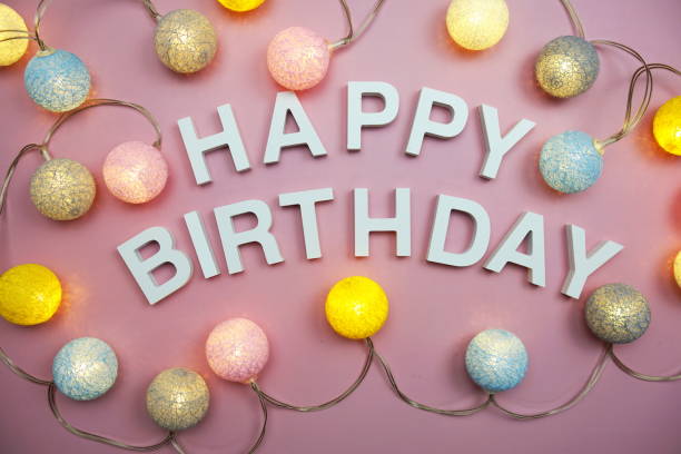 istock Happy Birthday alphabet letters on pink background 1430895352