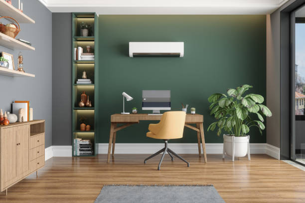 Home Office Interior With Air Conditioner, Table, Desktop Computer And Wooden Cabinet stock photo