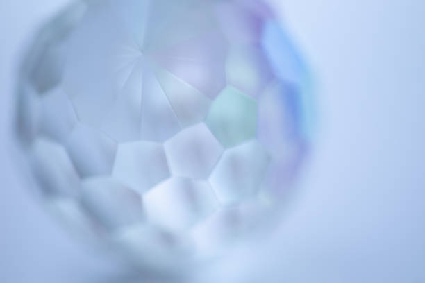 Close-up of illuminated lights shining on crystal pendants.
