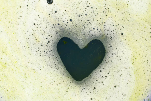 istock Dark green heart shape in foam,  close up 1430908005