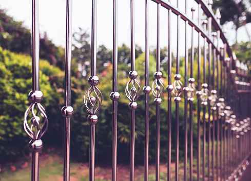 Stainless steel fence is bent into a spiral shape to prevent intrusion.