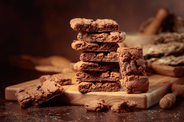 istock Brownie with mint on an old table with kitchen utensils. 1430910623
