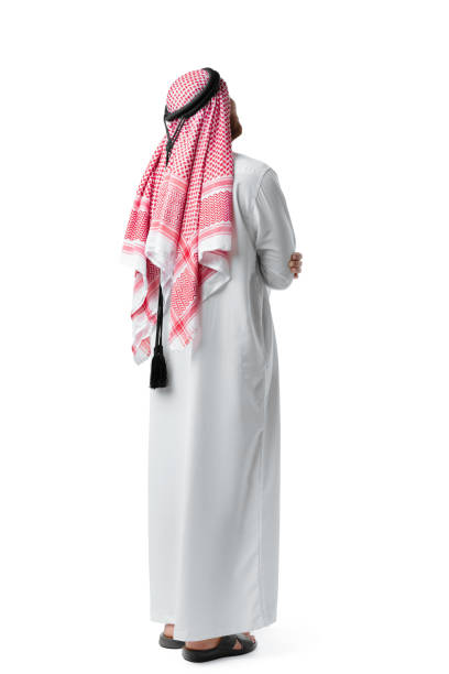 istock Back view of an Arab man standing on white isolated background 1430911785