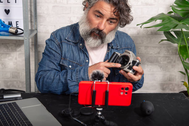 istock hipster blogger creating content for social networks while making a video at home. 1430913953