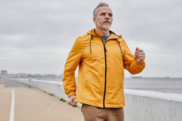 istock Handsome Mature Man Running Outdoors In City 1430914894