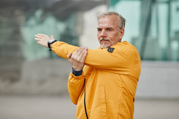 istock Handsome Mature Man Warming Up Outdoors 1430914916