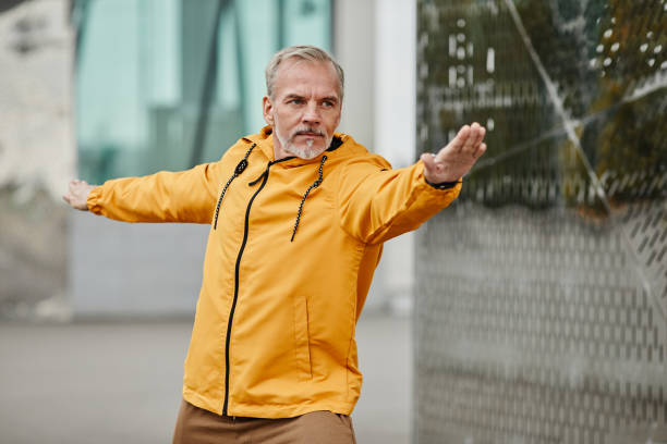 istock Active Mature Man Warming Up Outdoors 1430914919