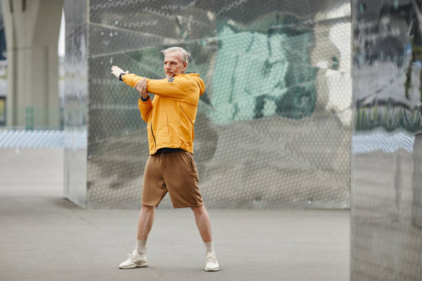 istock Mature Man Warming Up Outdoors 1430914924