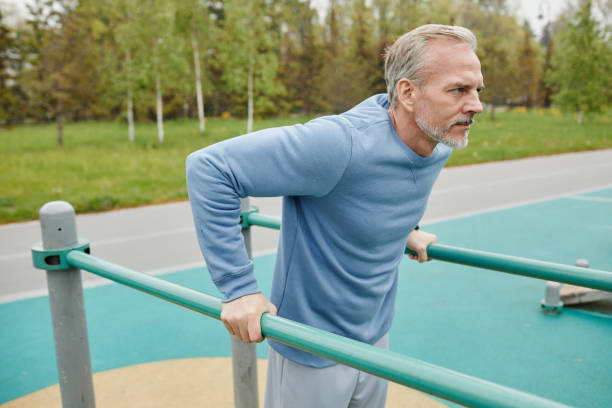 istock Active Senior Man On Parallel Bars Outdoors 1430915006