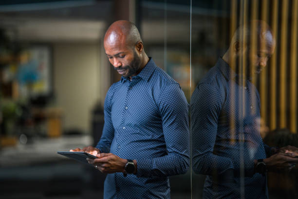istock Black Businessman in Early 40s Using A Digital Tablet 1430915737