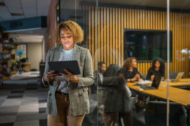 istock Hispanic Mid Adult Business Woman Using a Digital Tablet 1430915765