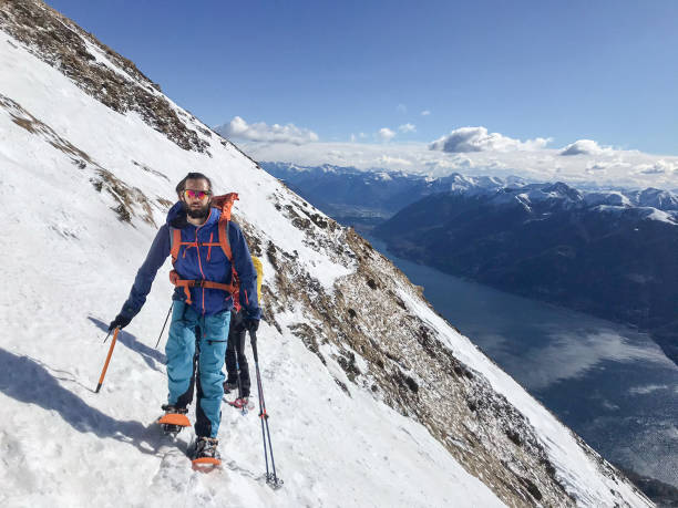 istock Alpinist moving on a snowy mountain crest 1430915886
